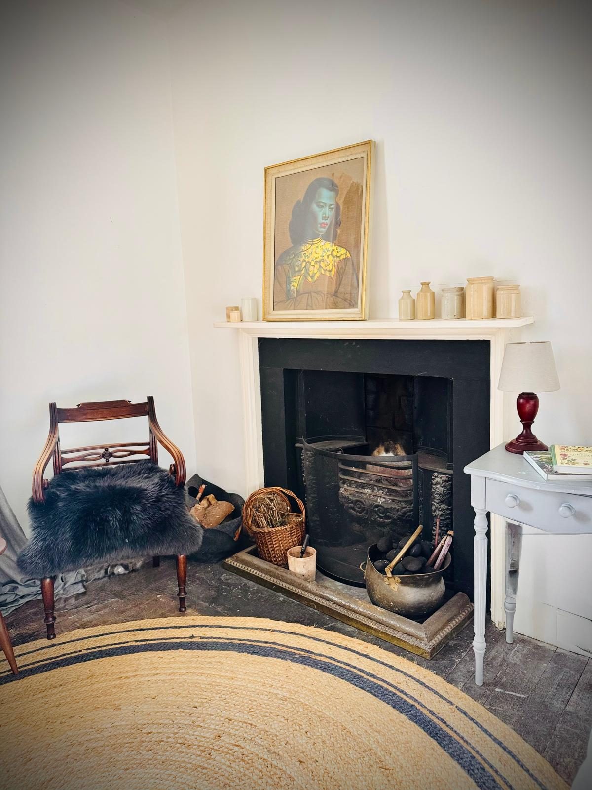 Fireside corner with warm lamplight